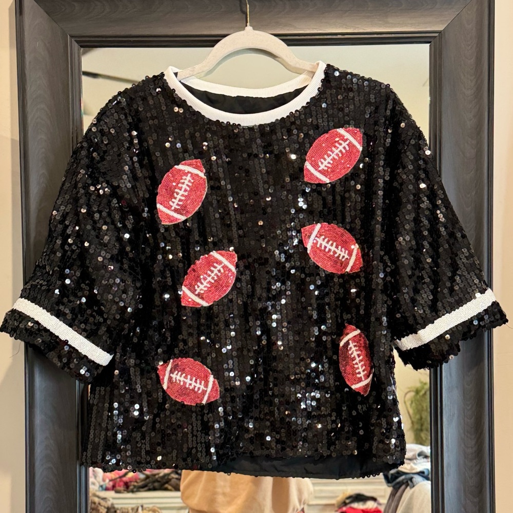 Black size large sequin with footballs jersey type shirt!